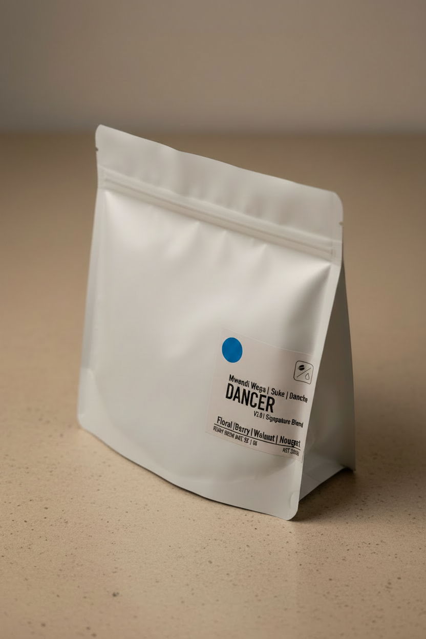 Dancer V3.0 Signature Blend coffee bag — white matte packaging standing upright with blue dot and tasting notes of floral, berry, and nougat